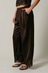 Black satin elastic waist lace trim wide leg pants featuring delicate lace trim at the hem for elegant style
