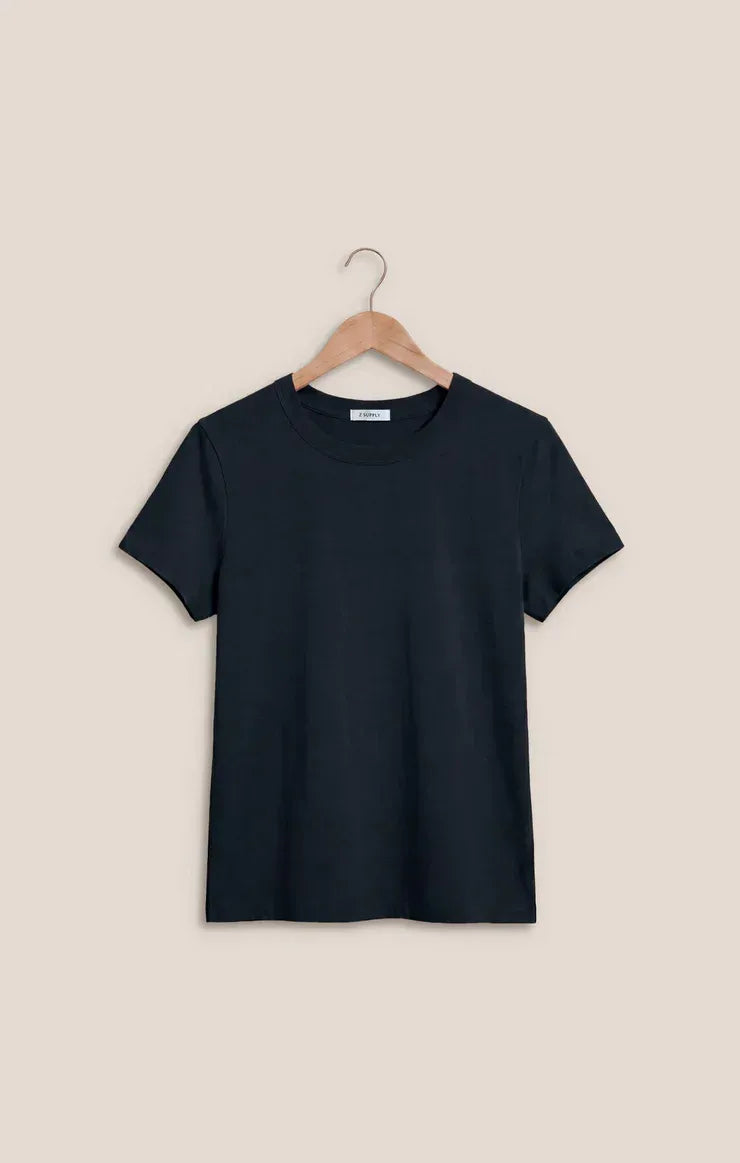 Black short-sleeved cotton basic tee junie cotton basic hanging on a wooden hanger with crew neck design