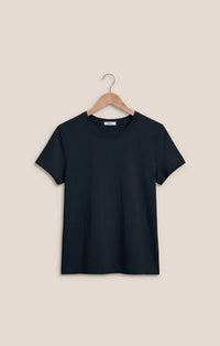 Black short-sleeved cotton basic tee junie cotton basic hanging on a wooden hanger with crew neck design