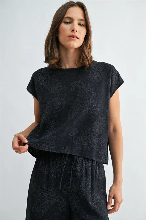 Black short-sleeved top with subtle paisley printed wide shoulder design perfect for stylish casual wear