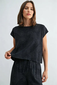 Black short-sleeved top with subtle paisley printed wide shoulder design perfect for stylish casual wear