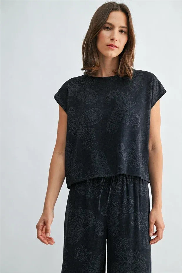 Black short-sleeved wide shoulder top with subtle paisley printed wide pattern for stylish casual wear