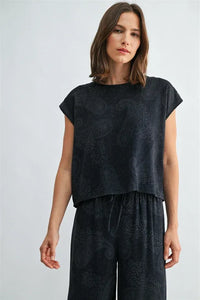 Black short-sleeved wide shoulder top with subtle paisley printed wide pattern for stylish casual wear