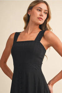 Black embroidered lace sleeveless empire midi dress with square neckline and lace trim at the waist