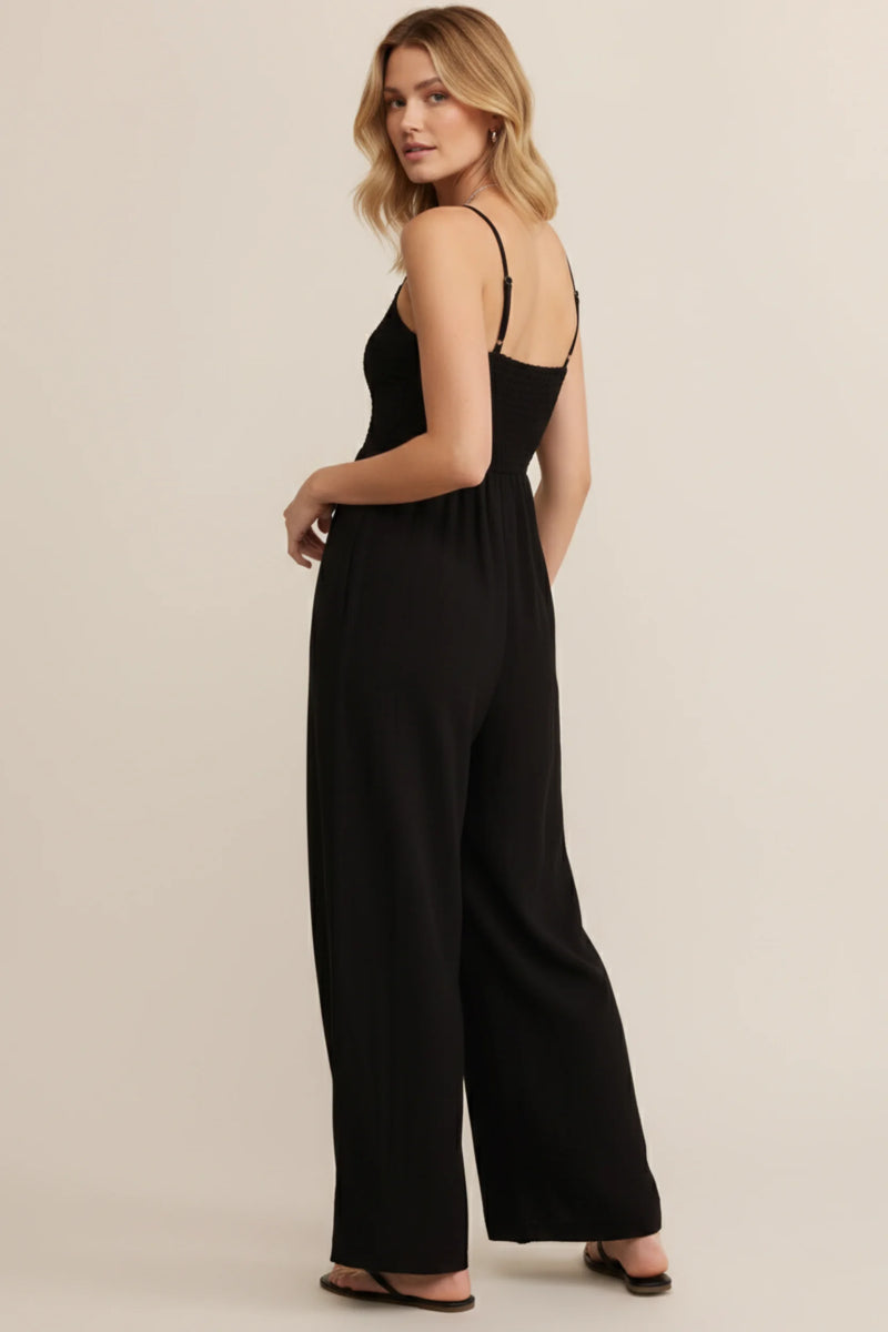Black smocked wide leg jumpsuit with adjustable straps