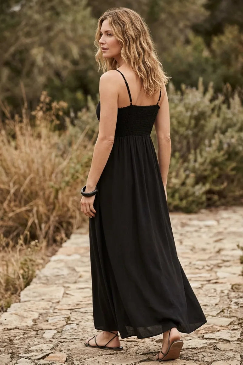 Black sleeveless angel eyes midi dress with thin straps and flowing skirt for elegant occasions