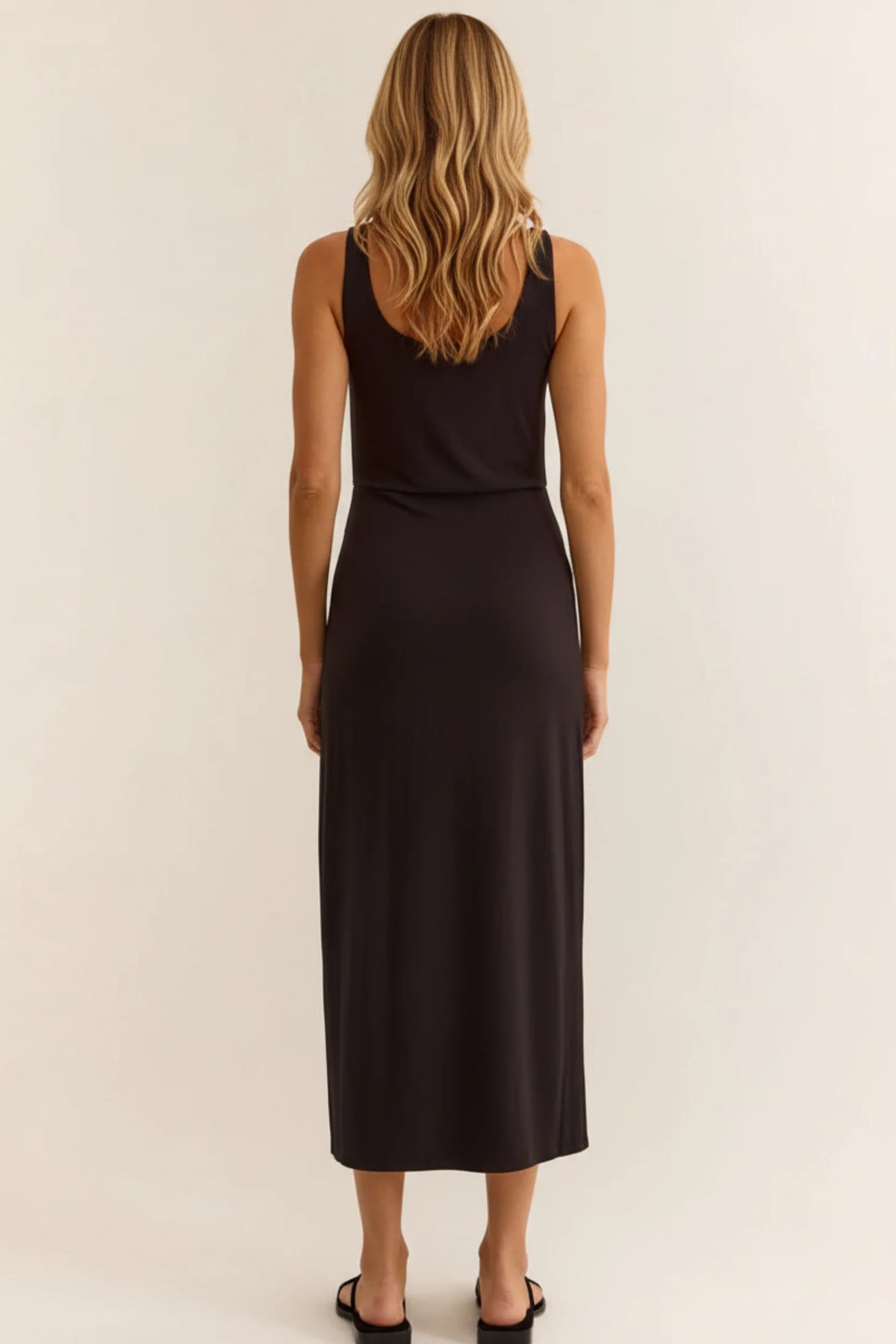 Black sleeveless night fitted midi dress with fitted bodice and flowing skirt