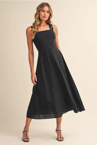 Black embroidered lace sleeveless empire midi dress with square neckline and intricate detailing along the hem