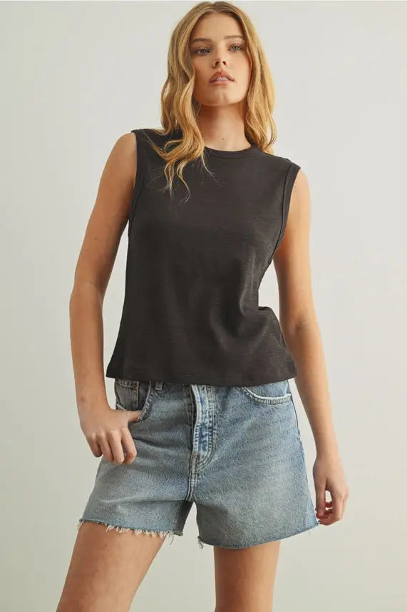 Black sleeveless cotton round neck top with relaxed fit and faded texture