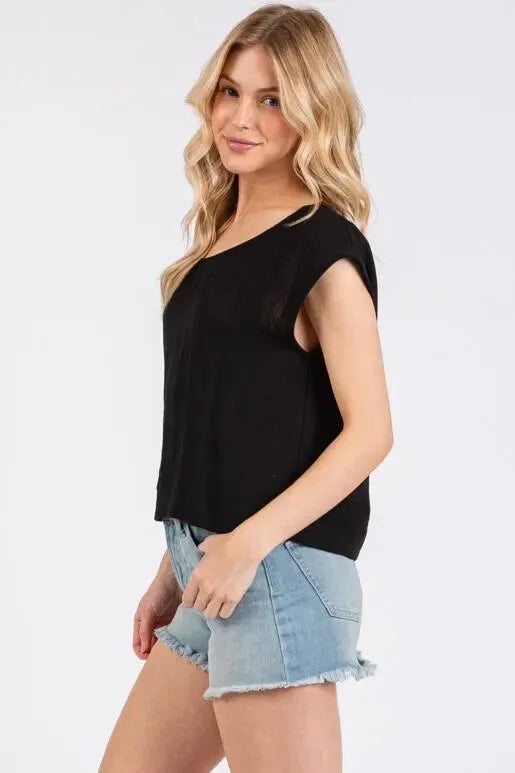 Black woven round neck boxy top with sleeveless design and soft flowing fabric for relaxed fit wear