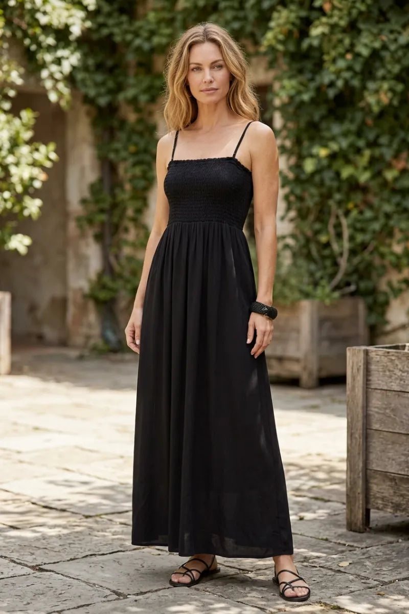 Black angel eyes midi dress with spaghetti straps gathered waist and flowing skirt in lightweight fabric