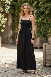 Black angel eyes midi dress with spaghetti straps gathered waist and flowing skirt in lightweight fabric