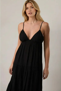 Black spaghetti strap tiered maxi dress with deep v-neckline
