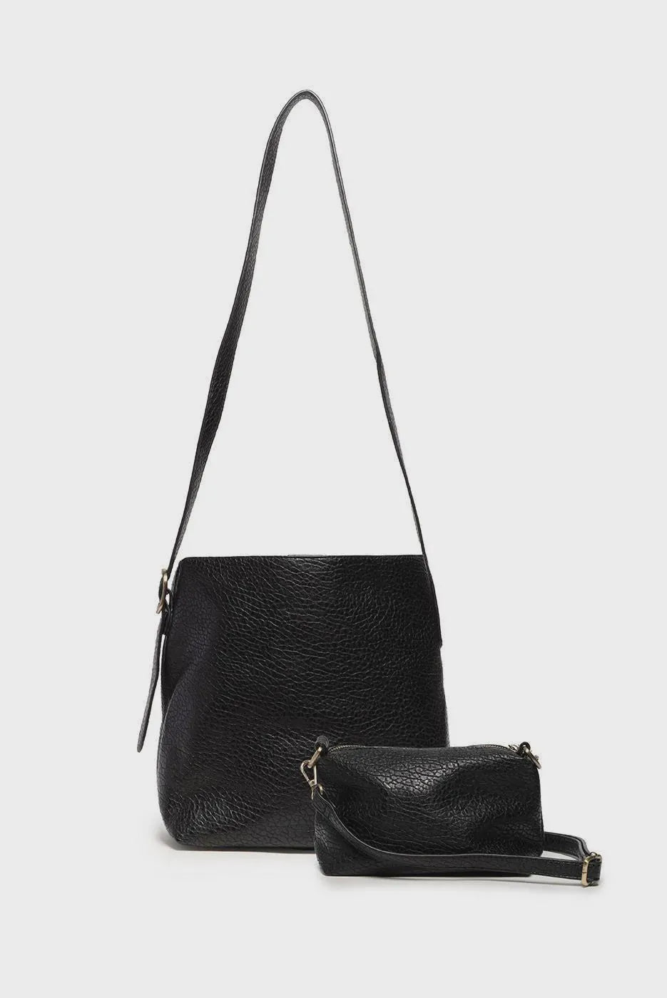 Andie 2 in 1 bucket crossbody black textured leather main bag with matching wristlet showcasing bag features