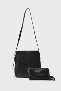 Andie 2 in 1 bucket crossbody black textured leather main bag with matching wristlet showcasing bag features