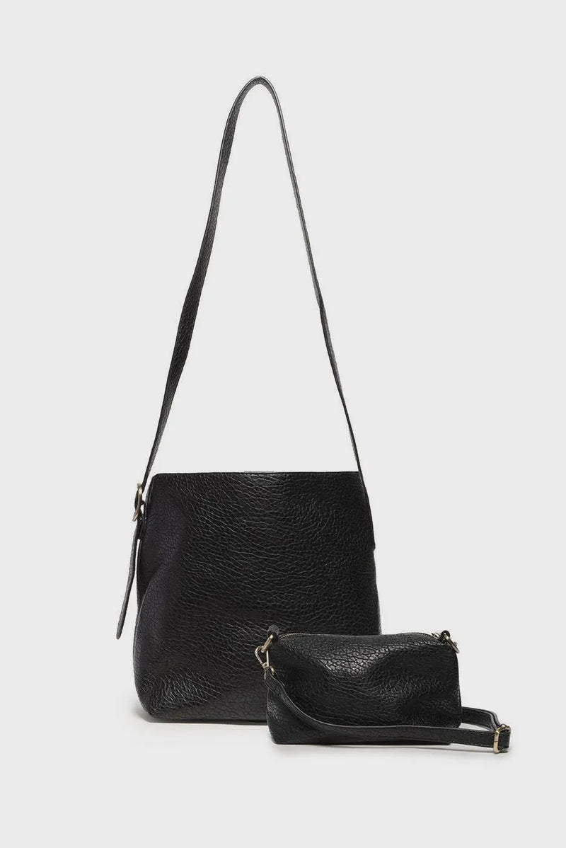 Andie 2 in 1 bucket crossbody black textured leather main bag with matching wristlet showcasing bag features