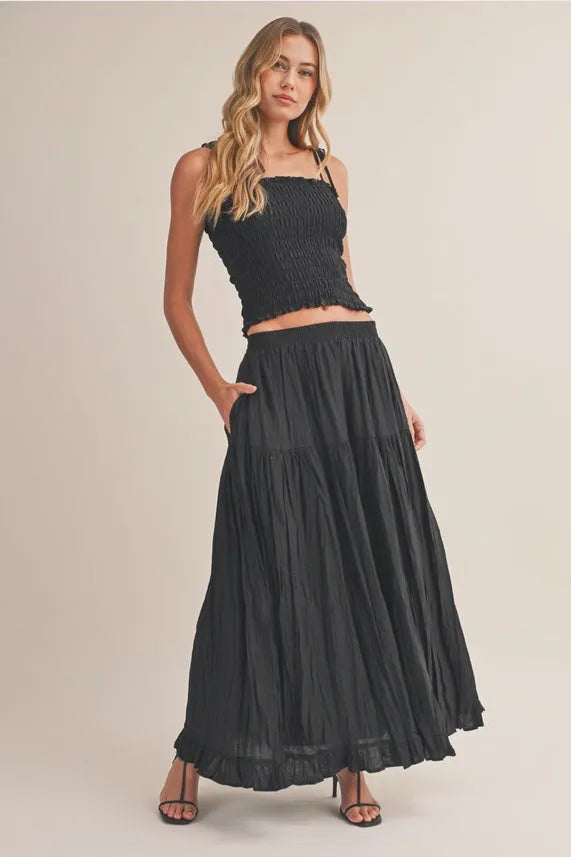 Black crinkled elastic maxi skirt with tiered pleated design