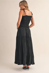 Black crinkled elastic maxi skirt with smocked bodice and tie straps