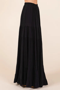 Black tiered flowy elastic waist lined maxi skirt with ruffled hem and flowing fabric for elegant wear