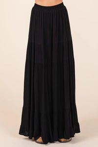 Black tiered flowy elastic waist lined maxi skirt with lightweight fabric and ruffled hem for elegant wear
