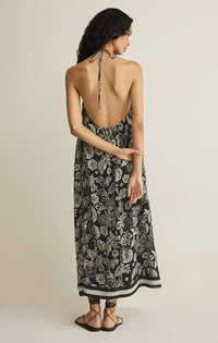 Black and white viento luz floral midi dress with halter neckline and back tie detail visible from the back side