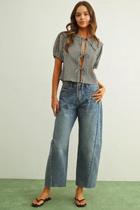 Black and white gingham short sleeve blouse with puffed sleeves and front tie detail in lightweight fabric