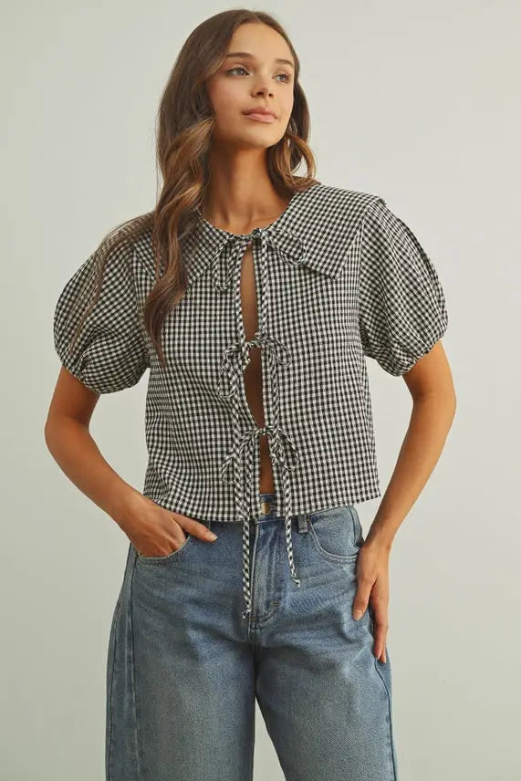 Black and white gingham short sleeve tie front top with puff sleeves in lightweight cotton fabric