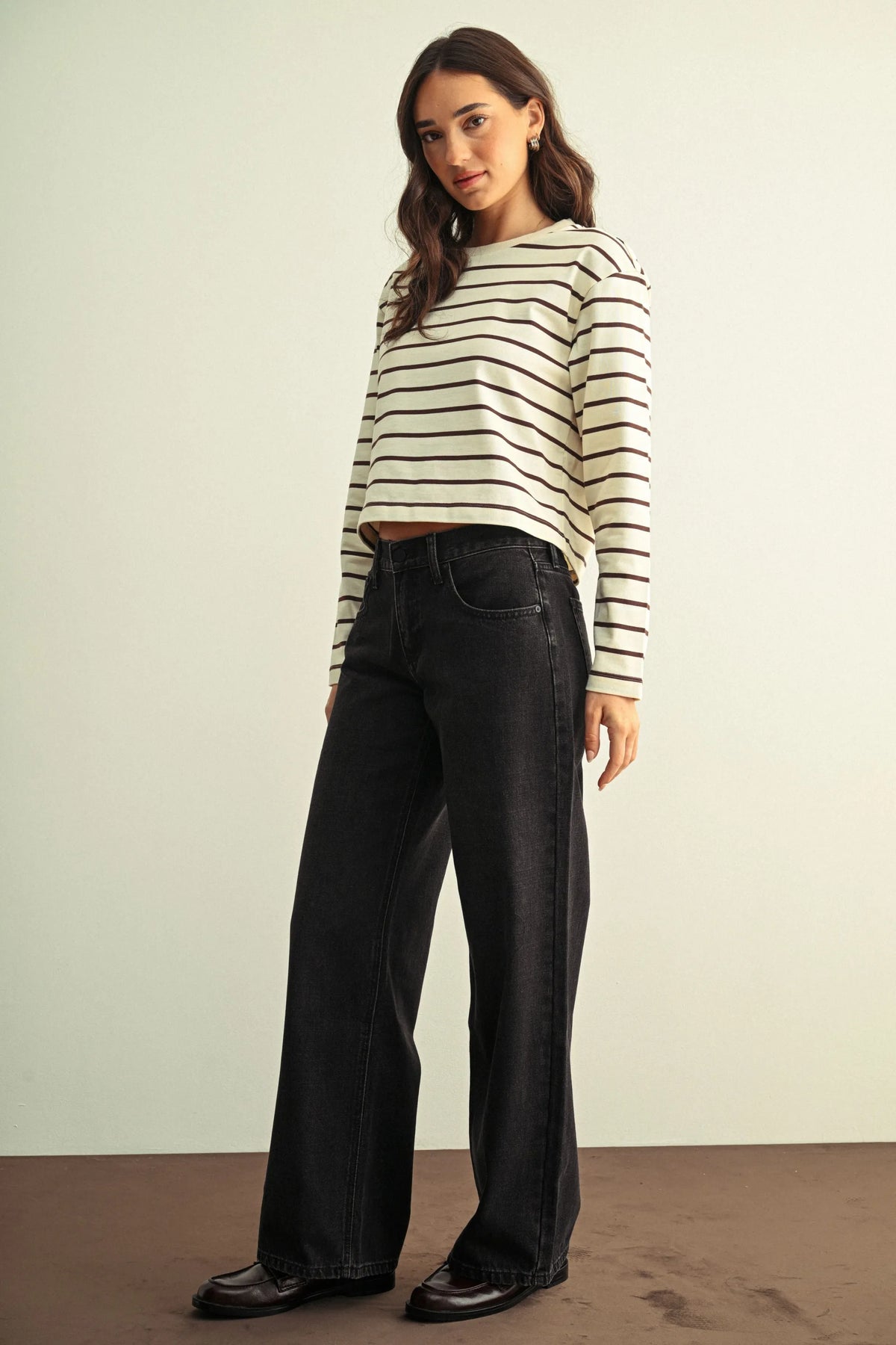 Black low rise baggy wide leg denim jeans with a straight fit and classic stitching details for casual wear