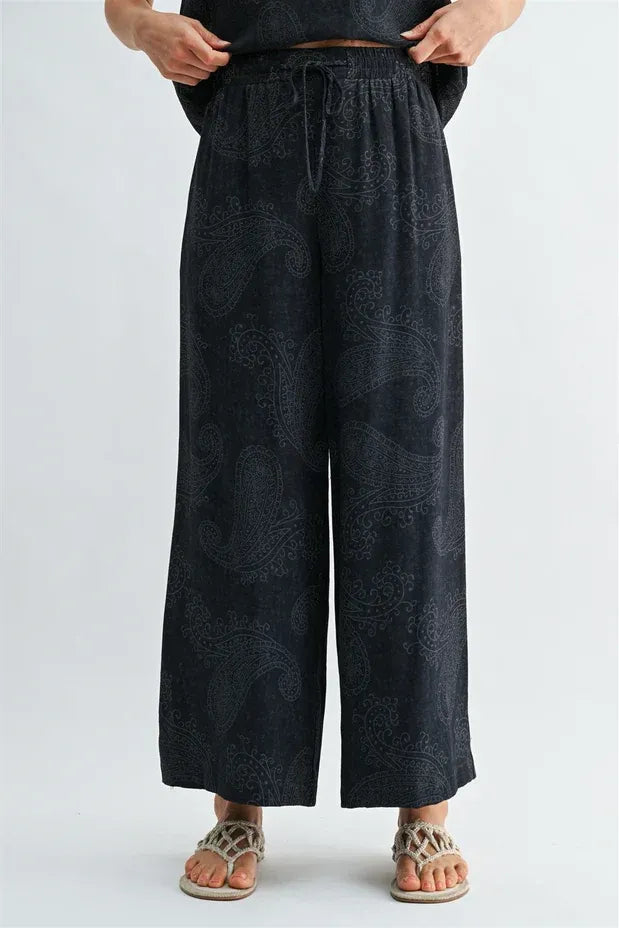 Black wide-leg pants with paisley printed elastic waistband and subtle pattern designed for comfortable wear elastic waist pants