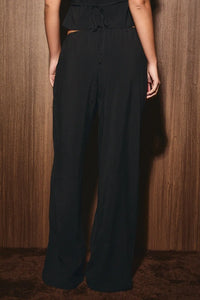 Black low rise wide leg drawstring pants with a comfortable waistband for casual wear