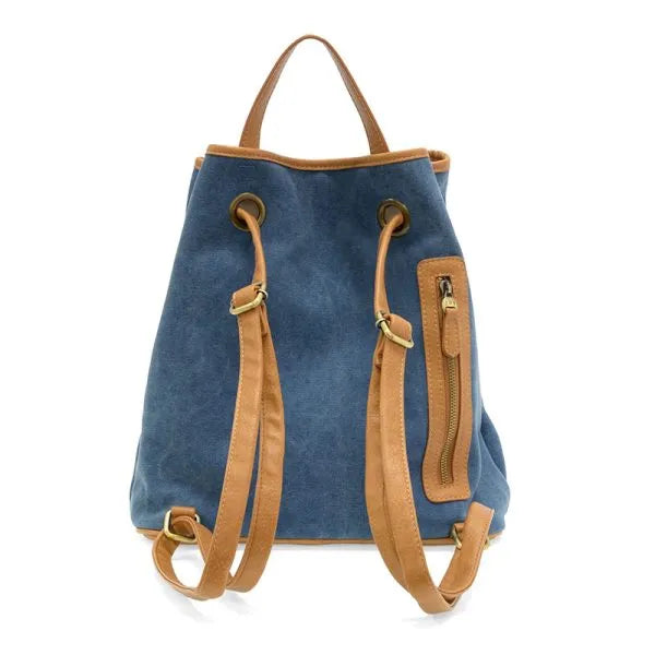 Blue memphis canvas backpack with tan leather straps and accents made from durable canvas material