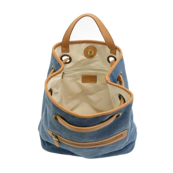 Blue memphis canvas backpack with tan leather handles and trim made of durable canvas material