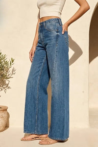 Blue denim high rise wide leg jeans featuring a classic five-pocket design and frayed hems