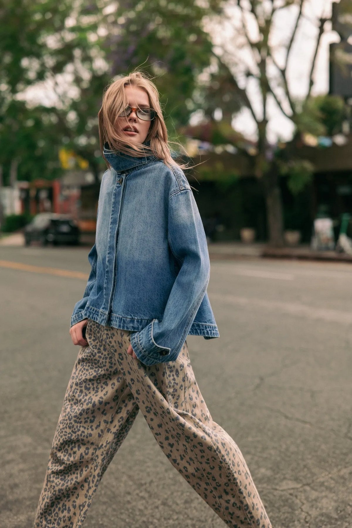 Blue denim jacket with high collar and zipper front in a shirts styled denim jacket design