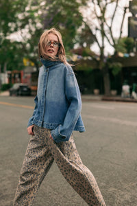 Blue denim jacket with high collar and zipper front in a shirts styled denim jacket design