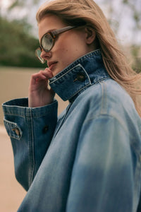 Blue denim jacket with high collar and buttoned cuffs in shirts styled denim jacket design