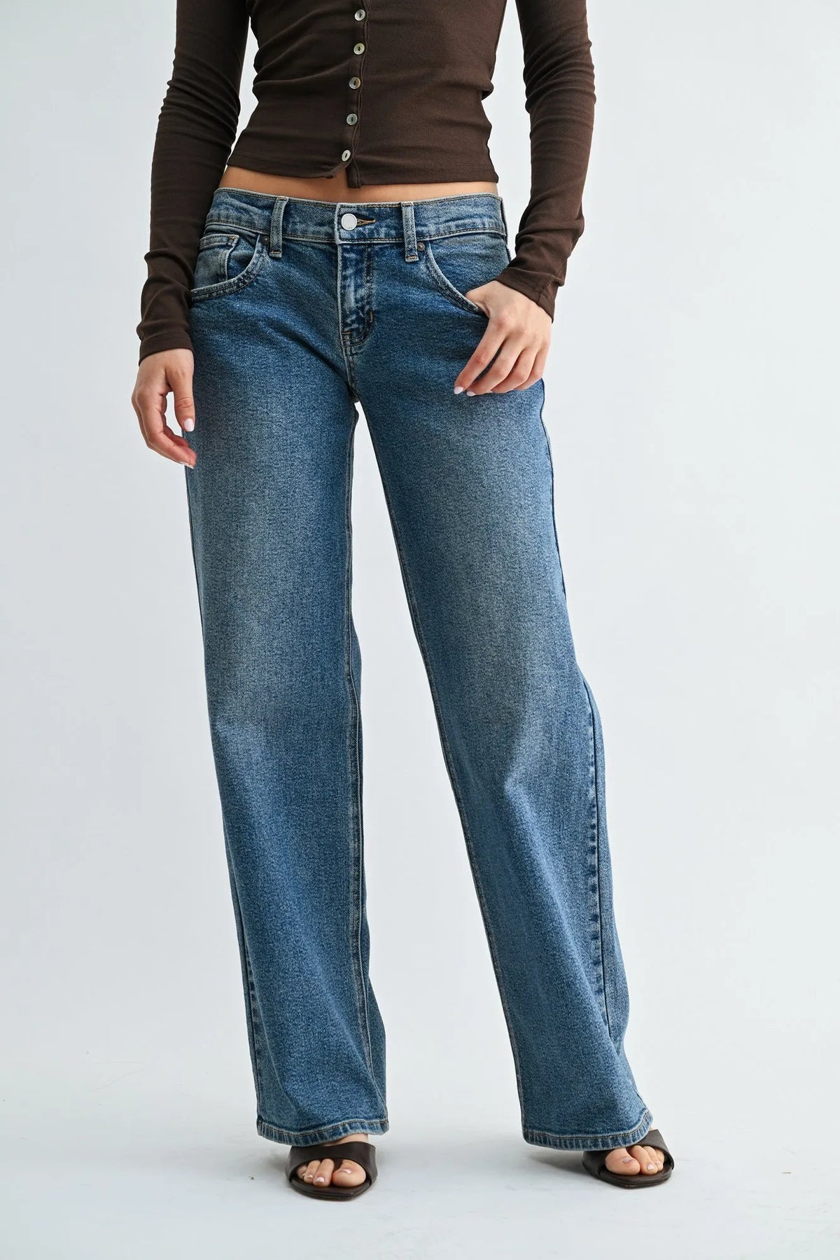 Low rise relaxed straight denim jeans in blue with classic five-pocket design and straight-leg cut made of denim