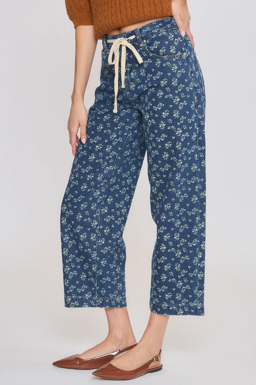 High rise floral straight leg denim jeans in blue with delicate white floral pattern and cream drawstring waistband