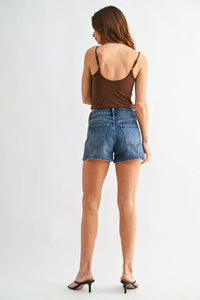 High rise classic hem denim shorts with five-pocket design and frayed hem