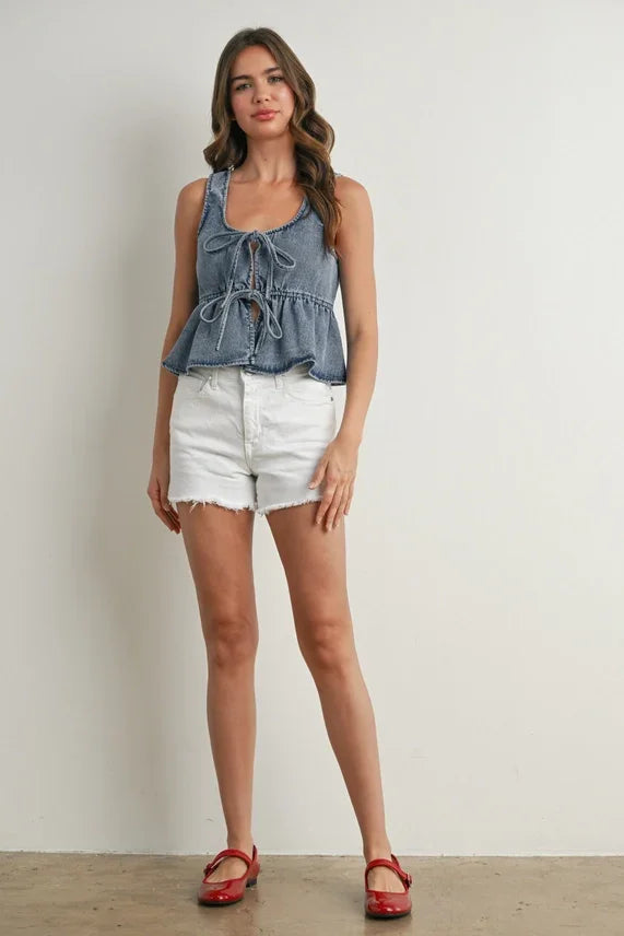 Blue ruffled hem tie-front top in denim with peplum and front tie