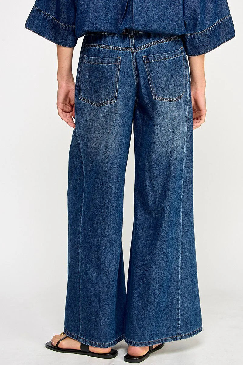 Blue drawstring wide leg denim pants with relaxed fit and back pockets