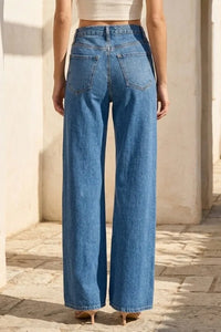 Blue denim wide leg high rise jeans shown from the back with classic back pockets and a relaxed fit design