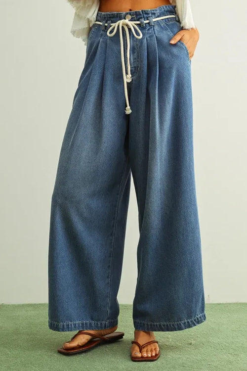 Blue denim pants with pleated front and cotton belt drawstring waist made from tencel fabric