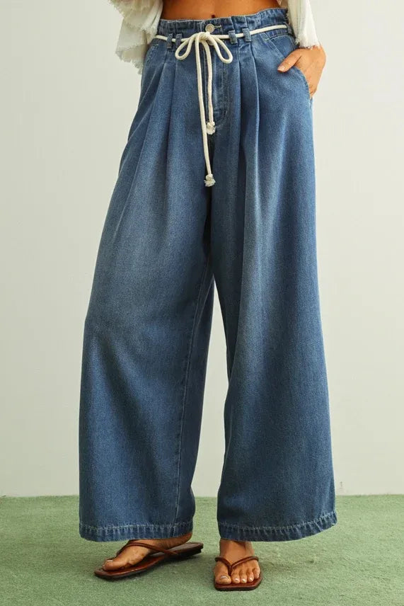 Blue denim pants with pleated front and cotton belt drawstring waist made from tencel fabric