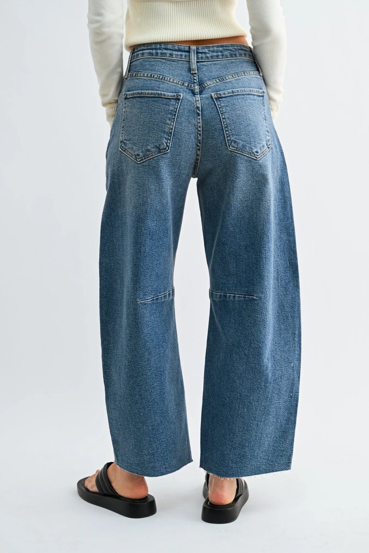 Blue denim wide leg denim jeans with a relaxed fit and visible stitching from the seamed barrel collection