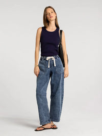 Blue denim wide-leg pants with white drawstring waistband paired with thread and supply edlin basic tank in basic tank style