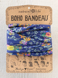 A blue floral-patterned boho bandeau headband made of soft fabric in tropic bandana navy by natural life