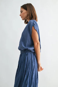 Flowing blue crinkle satin elastic hem top with draped sleeveless design