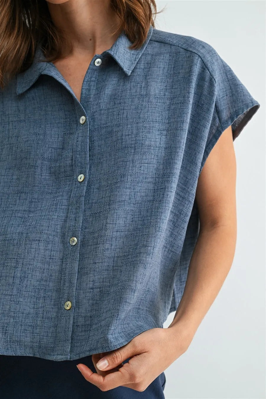 Blue linen dolman sleeve button down shirt with short sleeves textured weave and light green sleeve buttons