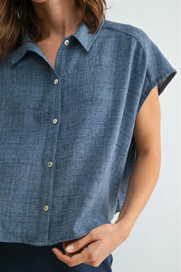 Blue linen dolman sleeve button down shirt with short sleeves textured weave and light green sleeve buttons